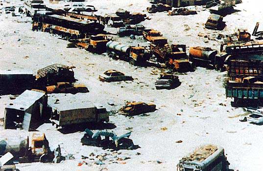 Highway of Death: Destroyed Iraqi tanks, trucks and cars lie everywhere. This road runs from Kuwait to Safwan at the Iraqi border and on to Basra. The American soldiers called it the "Highway of Death." (Courtesy of Cassandra Garner, taken March 1991 in southern Iraq)