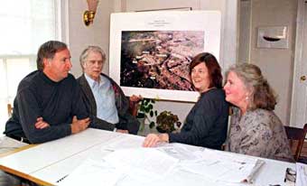  In front of an aerial photo of Starmet Corporation, Judy Scotnicki (third from left), Mary Jane Williams, and other CREW members discuss ways of removing radioactive contamination. (Concord, Massachusetts)